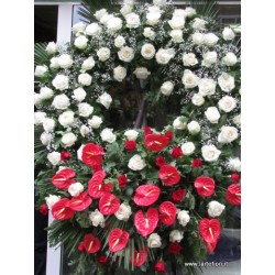 Great funeral wreath of white roses and anthurium red