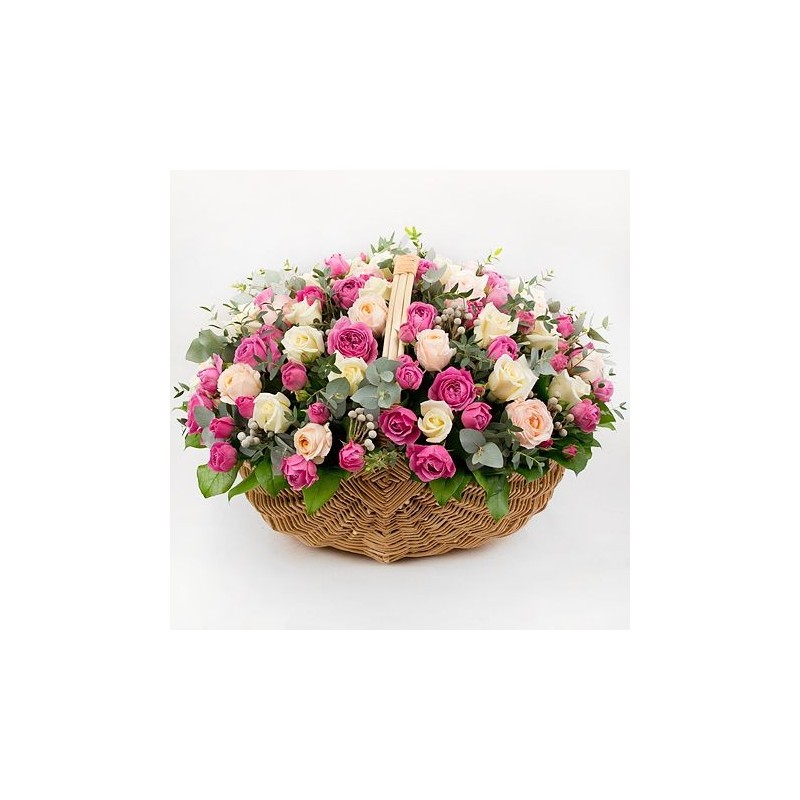 Basket with two dozen pink roses in a beautiful wicker basket.