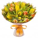 Bouquet of yellow tulips, orange tulips and mimosa