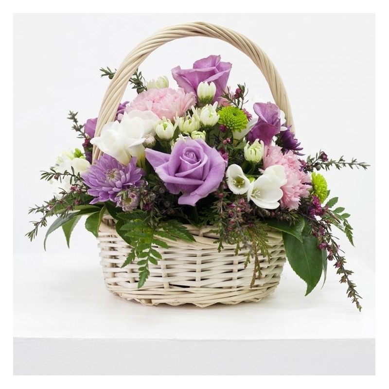 Compositions of flowers in a basket