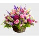 Compositions in basket with pink roses and daisies
