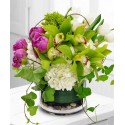 Great Composition in the glass with orchids and tulips, peonies