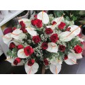 cushion size medium with anthurium and red roses in green complementary