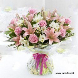 A dozen roses and lilies in pink tones clear