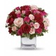 Cubo in verto con bouquet di rose 